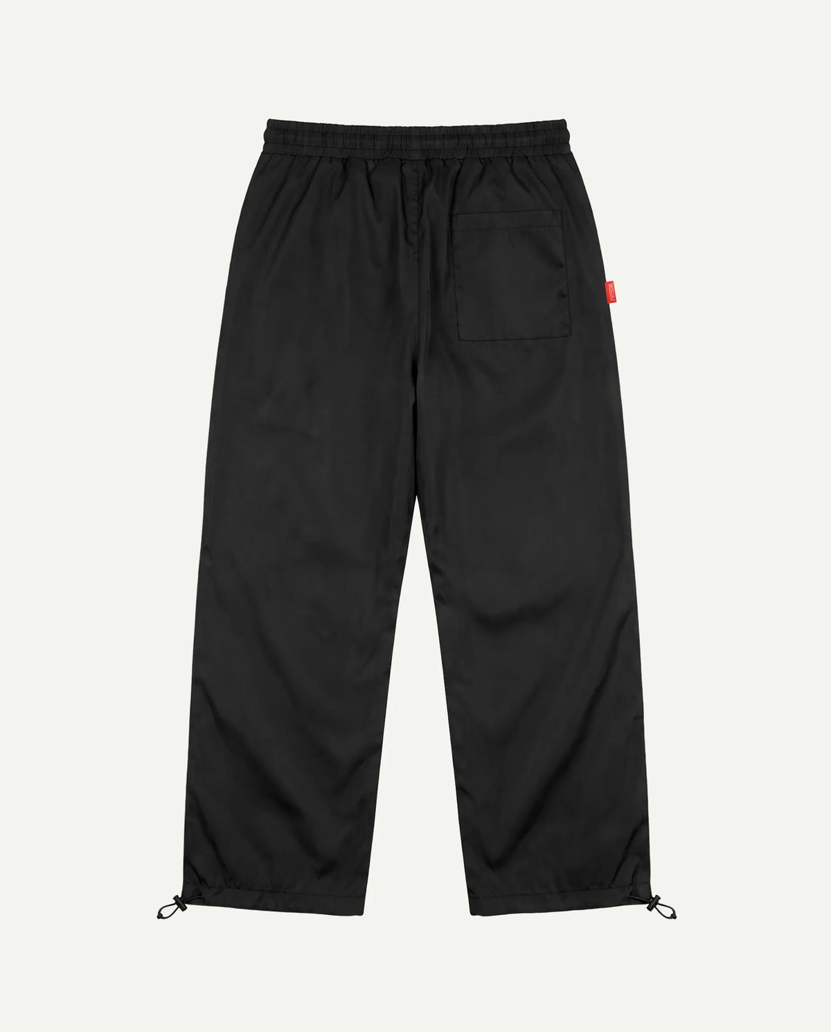 Calça baggy corta-vento preta PRISON vista de costas
