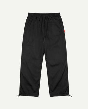 Calça baggy corta-vento preta PRISON vista de costas