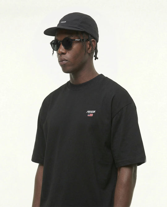 Camiseta oversized Flag Logo EUA preta PRISON® vista frontal